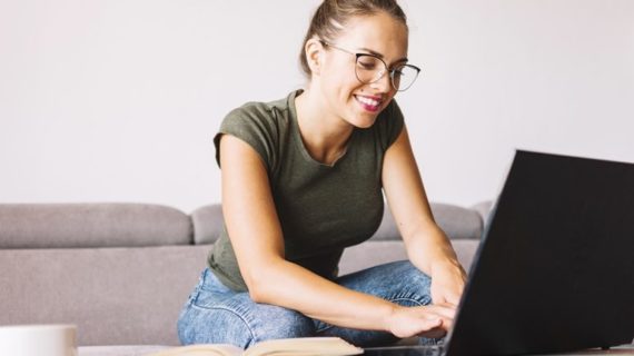 woman typing on her laptop