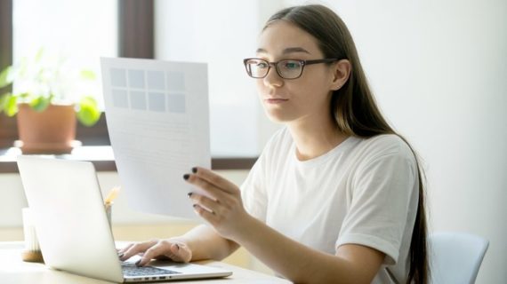 woman designer looking at the paper