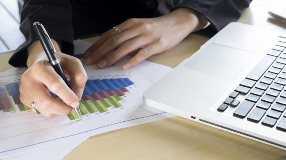 hand of businesswoman writing