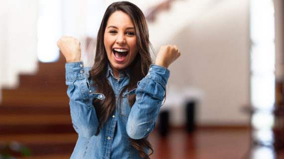 over excited young woman wearing denim shirt