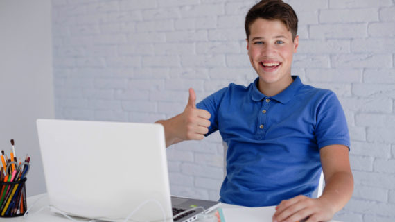 happy young man doing thumbs up