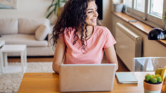 cheerful woman looking through the window