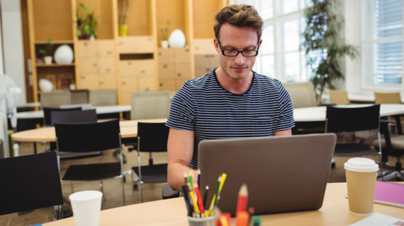 man busy working on his laptop