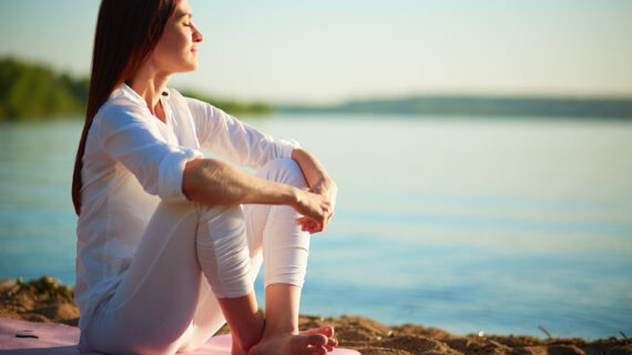 woman relaxing by the shore