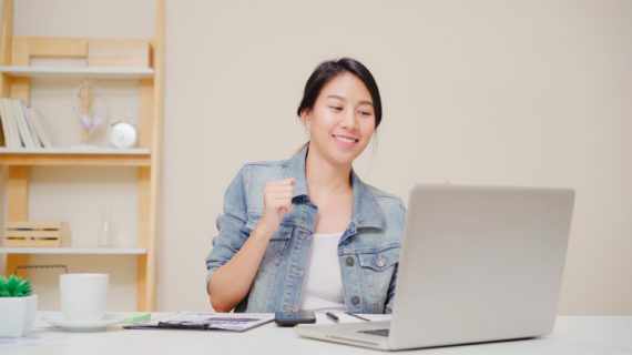 young asian woman working using laptop