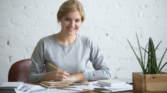 young attractive student at the table