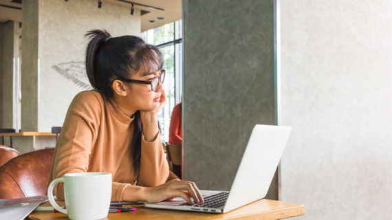 Lady with laptop at table