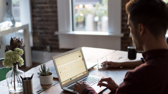 Man at a laptop in an office