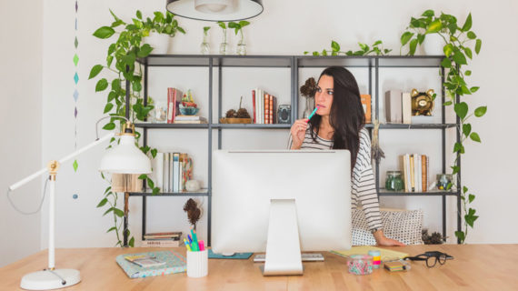 Young businesswoman thinking