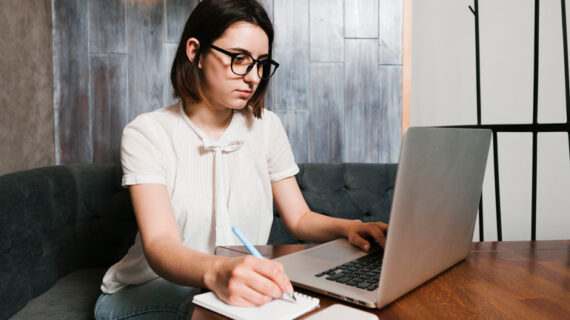 Young woman in the office working on laptop