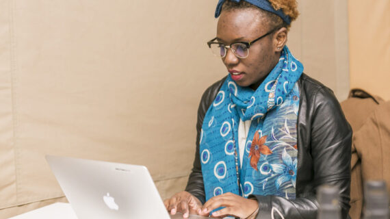 African woman working using with her laptop