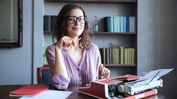 Writer work using typewriter