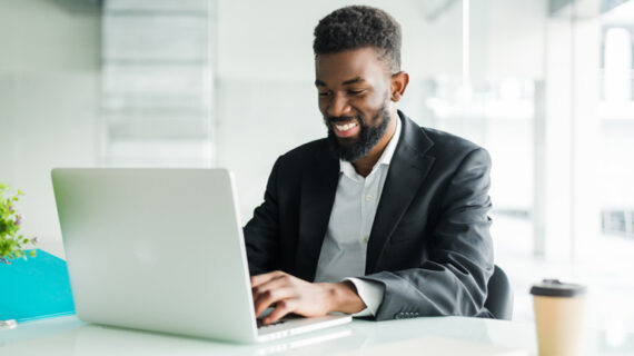 african american businessman using laptop