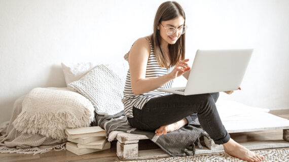 young-woman-works-remotely-computer