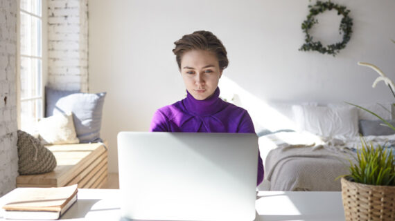 young female freelancer browsing job recruitment websites