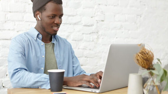 man using silver laptop