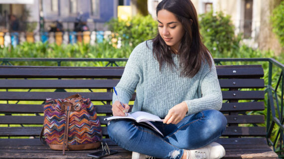 young woman writing notes