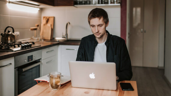 Thoughtful man working online