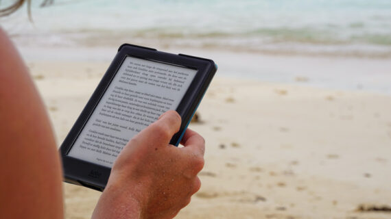 Person holding black tablet