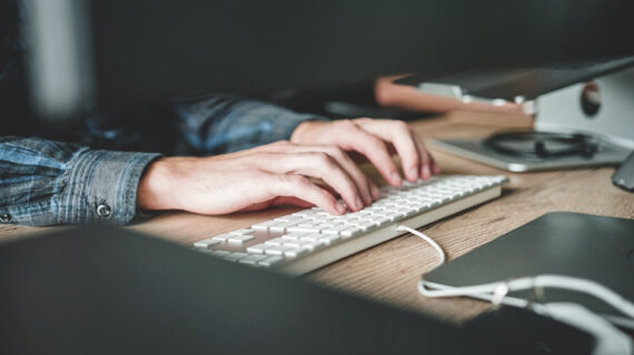 Person using computer keyboard