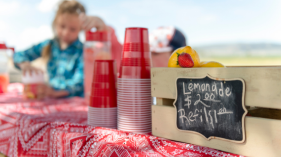 Children sell drinks at lemonade stand