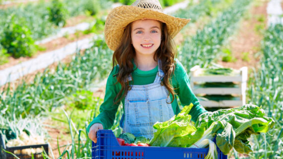 girl harvesting vegetables