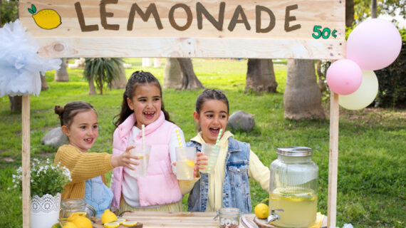 three little girls running lemonade stand