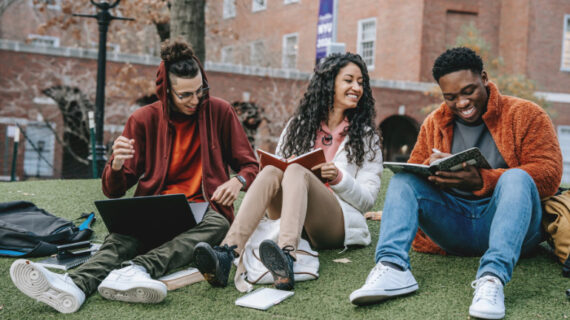 cheerful multiethnic young adults with books