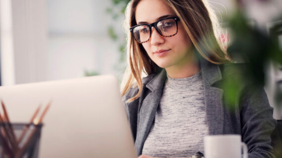 woman working using her laptop