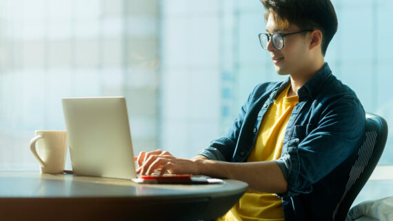 male wearing glasses work remotely