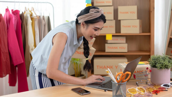 business woman use a laptop to receive and review orders online