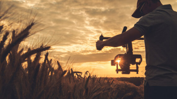 man shooting videos with a gimbal stabilizer