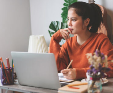 woman creative freelancer working on laptop computer