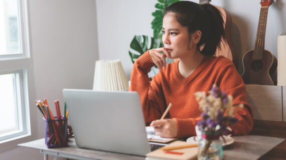 woman creative freelancer working on laptop computer