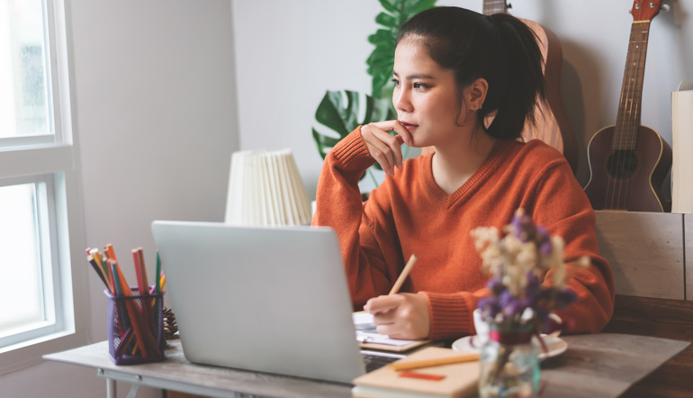 woman creative freelancer working on laptop computer