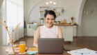 Beautiful young asian woman working on laptop computer