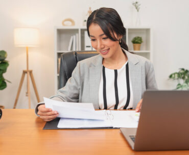 Young asian businesswoman working in office