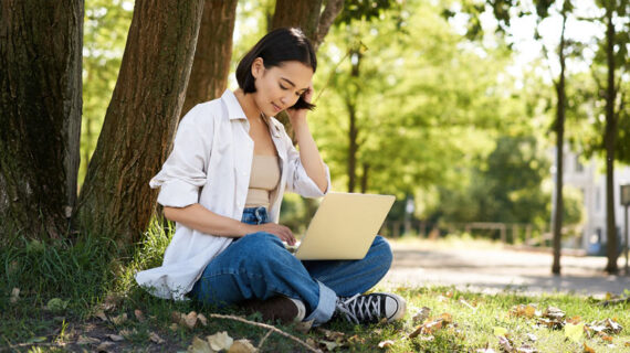 Remote work smiling asian girl student doing homework