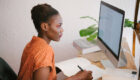 woman looking on computer