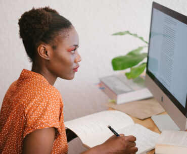 woman looking on computer