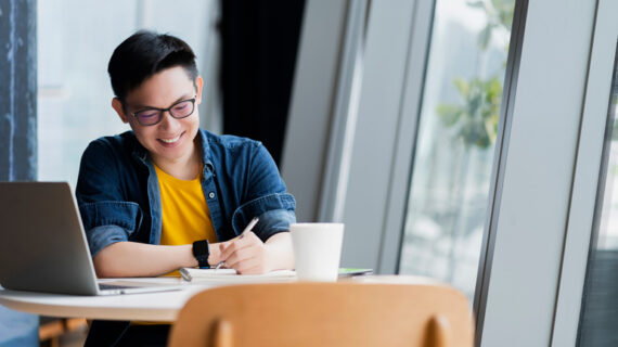 attractive positive asian business male wearing glasses