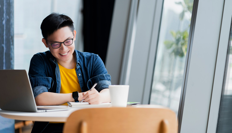 attractive positive asian business male wearing glasses