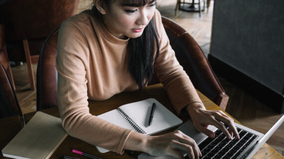 Girl typing on laptop