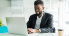 african american businessman using laptop