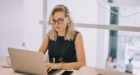 woman using laptop while working